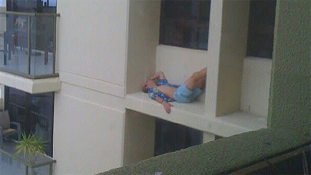 Cameron Cox was snapped sleeping on the ledge of his 11th storey apartment balcony. Source: Instagram.