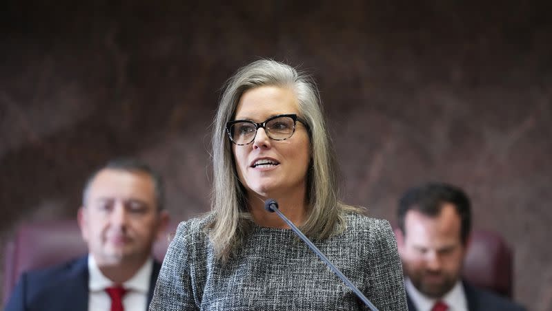 Democratic Arizona Gov. Katie Hobbs, center, delivers her state of the state address at the Arizona Capitol in Phoenix on Jan. 9, 2023.