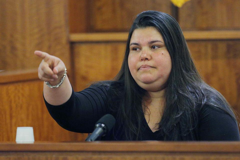 House cleaner Carla Barbosa points to former New England Patriots player Aaron Hernandez, as she testifies in his murder trial at Bristol County Superior Court in Fall River, Massachusetts, February 24, 2015. Hernandez is accused of the murder of Odin Lloyd in June 2013. REUTERS/Brian Snyder (UNITED STATES - Tags: CRIME LAW SPORT FOOTBALL)