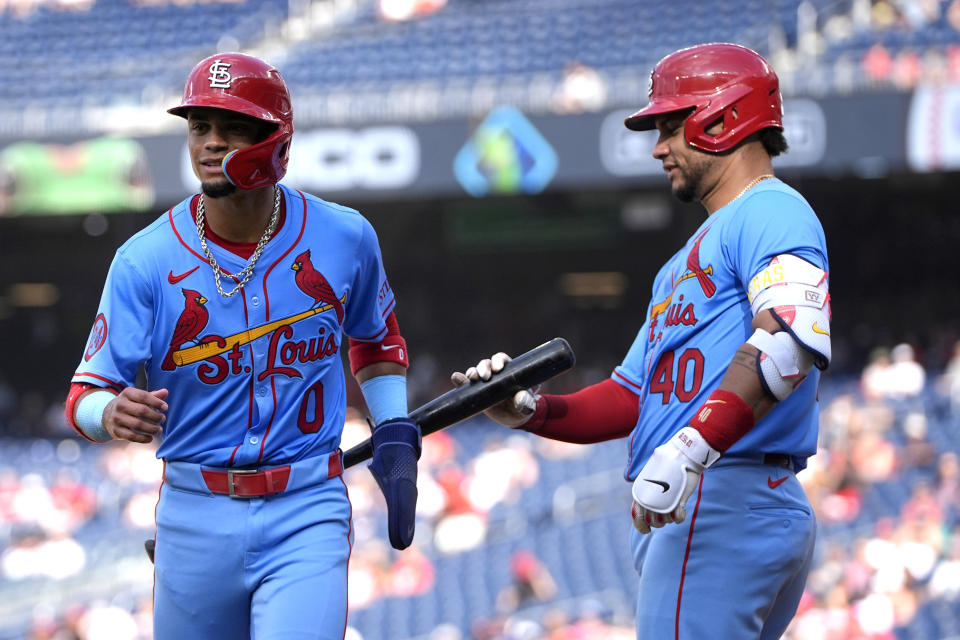 St. Louis Cardinals' Masyn Winn (0), left, is congratulated by Willson Contreras (40) after scoring on a wild pitch during the fourth inning of a baseball game against the Washington Nationals at Nationals Park, Saturday, July 6, 2024, in Washington. (AP Photo/Mark Schiefelbein)