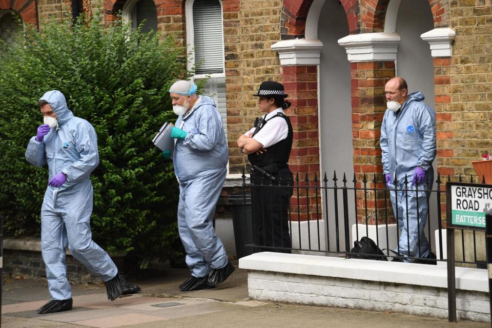 Forensics and a police officer outside the home of Simonne Kerr (PA)