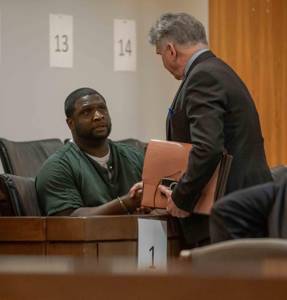 Vernon Sanders speaks to his lawyer John Reilly in Monmouth County Superior Court for his sentencing for aggravated manslaugter of Denzel Morgan-Hicks.