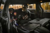 Jean Ryan, right, president of the advocacy group Disabled In Action, has her motorized wheelchair secured in a van for a ride into Manhattan from Brooklyn, Wednesday, Feb. 7, 2024, in New York. The Big Apple is close to implementing a plan that would use license-plate readers to turn all of Manhattan south of Central Park into one giant toll zone. (AP Photo/Bebeto Matthews)