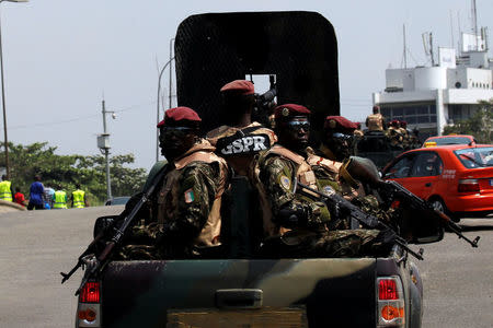 Soldiers of the Ivory Coast presidential guard patrol as they arrive at the port of Abidjan, Ivory Coast January 18, 2017. REUTERS/Luc Gnago