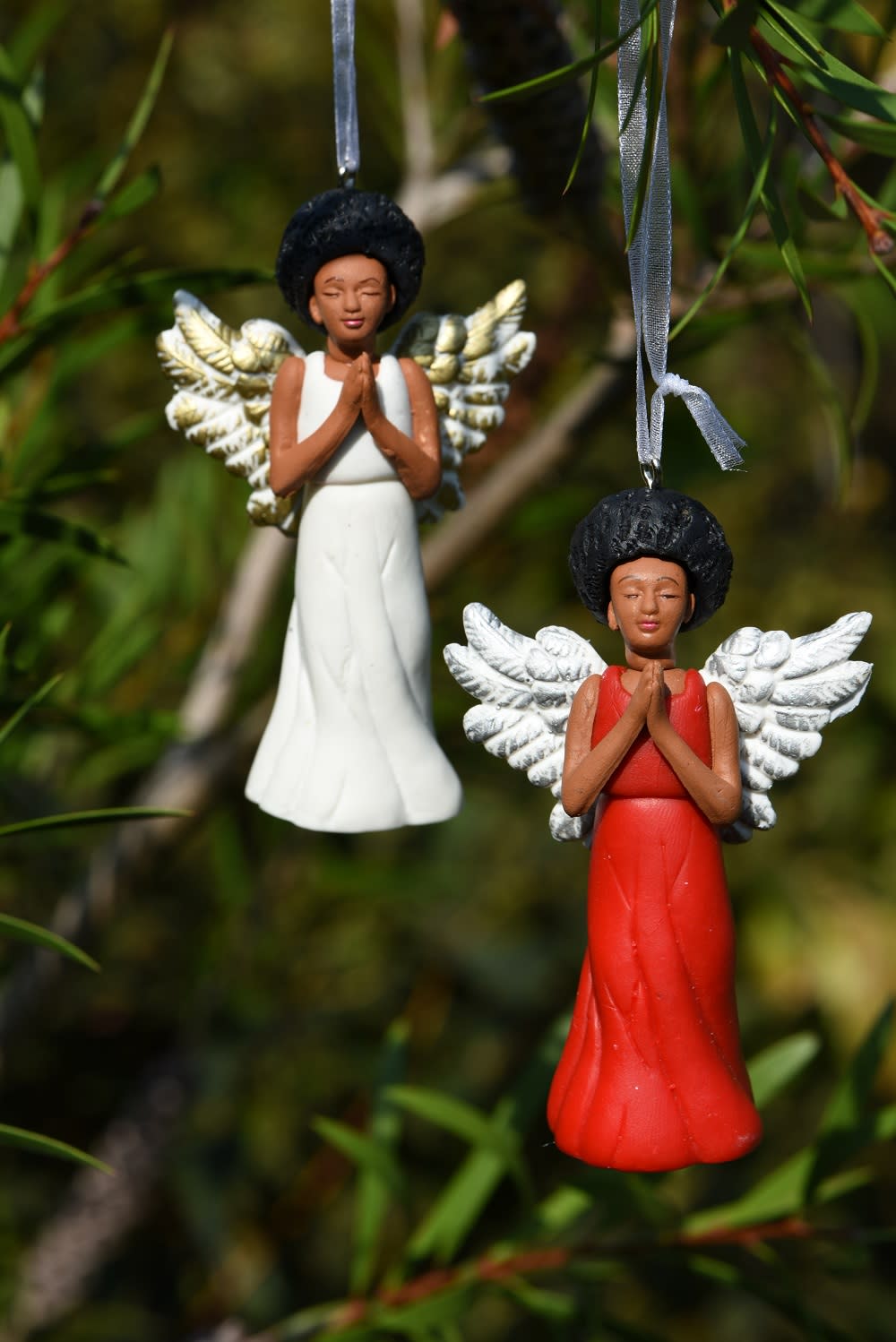 Porcelain angels from March Muses, the company that create diverse Christmas decorations. (March Muses/PA)