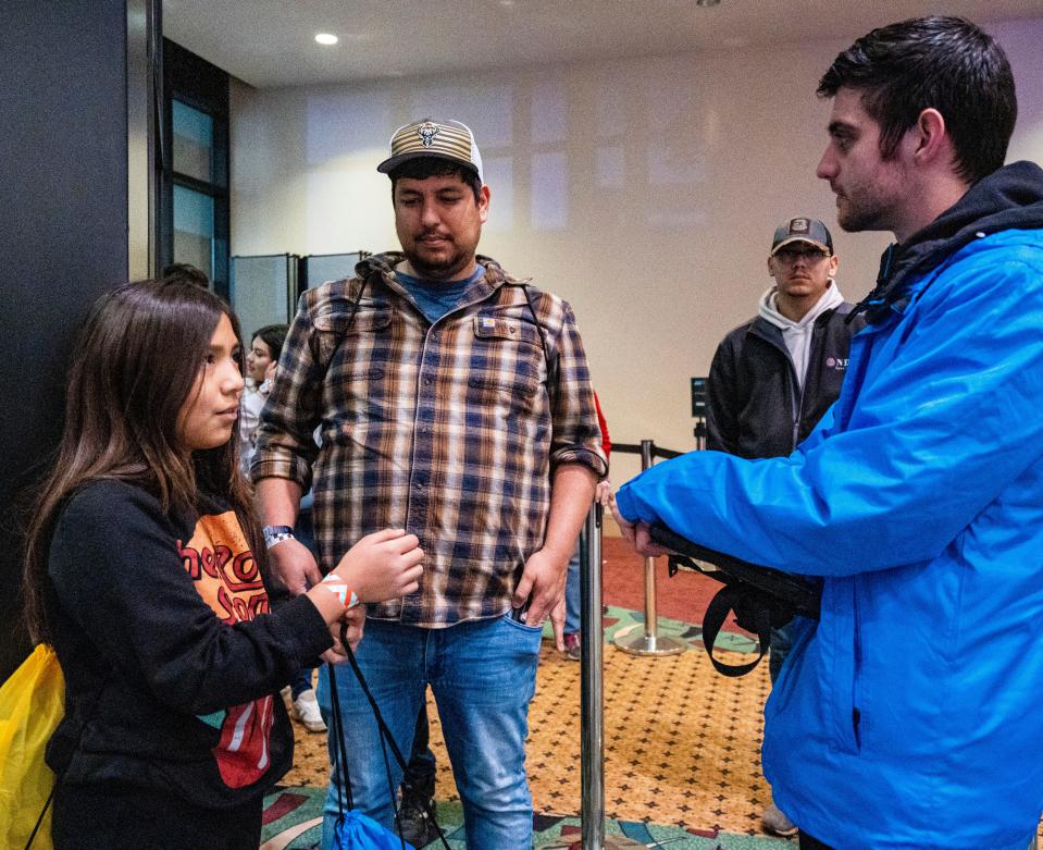 Andy Mendizabal and his daughter 10-year-old Sophia Mendizabal prepare to test drive the new Dodge Challenger with Jacob Swick, in-vehicle host for DRIVE, at the Milwaukee Auto Show on Saturday February 25, 2023 at the Wisconsin Center in Milwaukee, Wis.