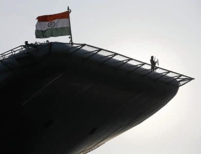 An Indian soldier stands guard on Indian Navy's largest aircraft carrier INS Vikramaditya at Colombo port in Sri Lanka January 21, 2016. REUTERS/Dinuka Liyanawatte