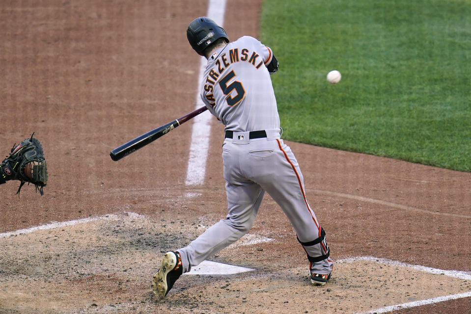 San Francisco Giants' Mike Yastrzemski hits a sacrifice fly to center field off Pittsburgh Pirates relief pitcher Wil Crowe during the sixth inning of a baseball game in Pittsburgh, Saturday, June 18, 2022. (AP Photo/Gene J. Puskar)