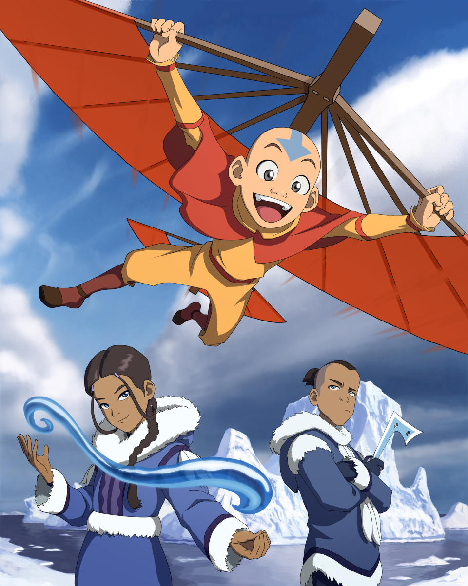 Katara and Aang bending while Sokka stands there with his boomerang