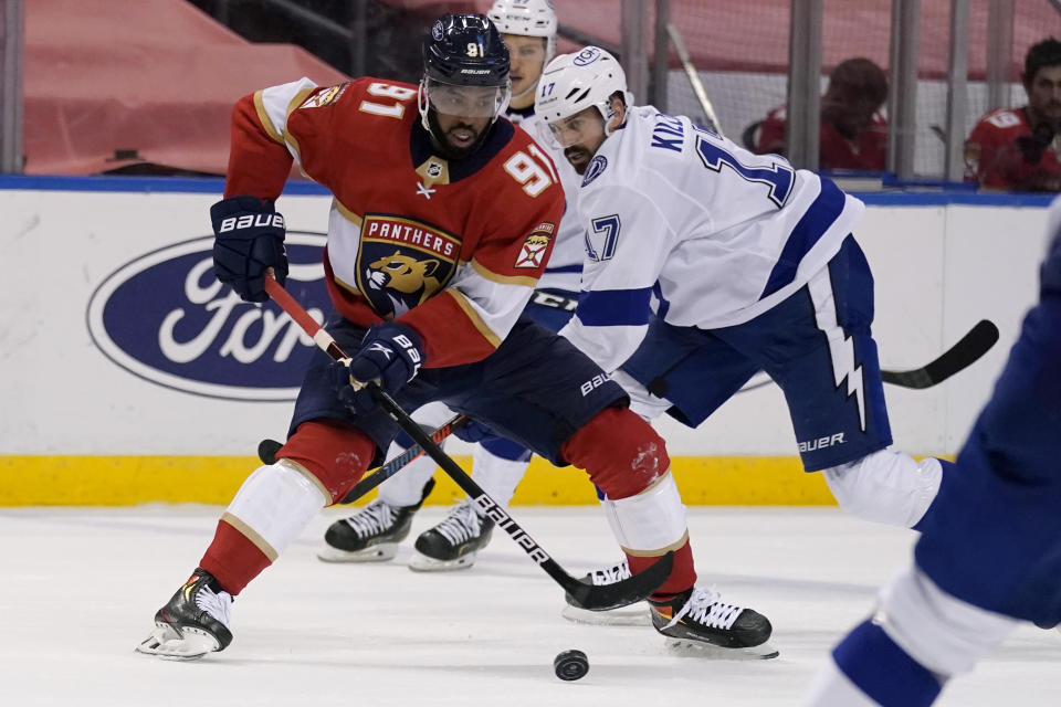 Florida Panthers left wing Anthony Duclair (91) controls the puck as Tampa Bay Lightning left wing Alex Killorn (17) defends during the second period of an NHL hockey game, Monday, May 10, 2021, in Sunrise, Fla. (AP Photo/Lynne Sladky)