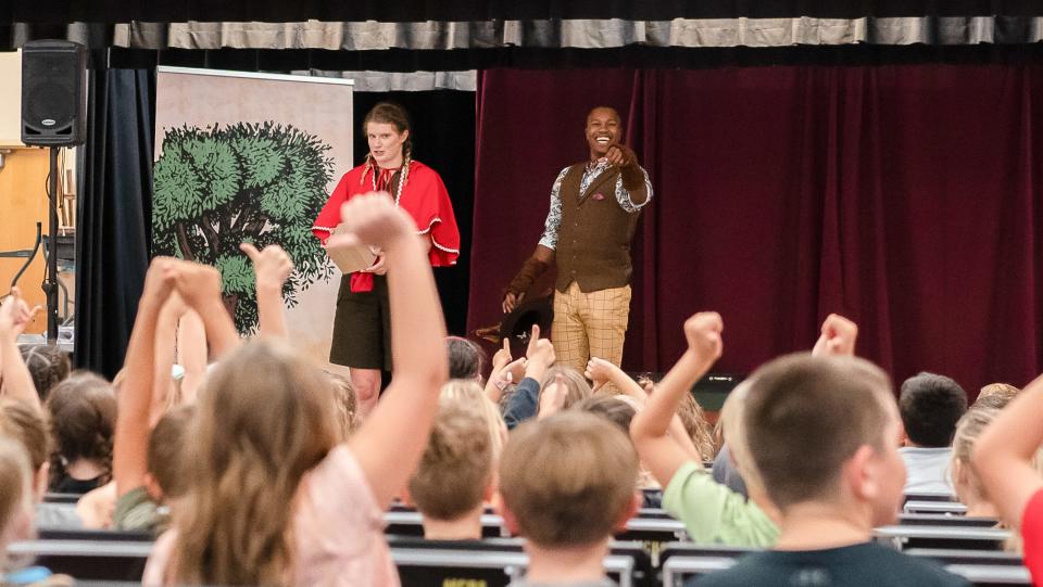 Florida Studio Theatre acting apprentices Lorelei Frank, left, and James Randolph perform Allison Gregory’s version of “Red Riding Hood” for students at Tatum Ridge Elementary School.