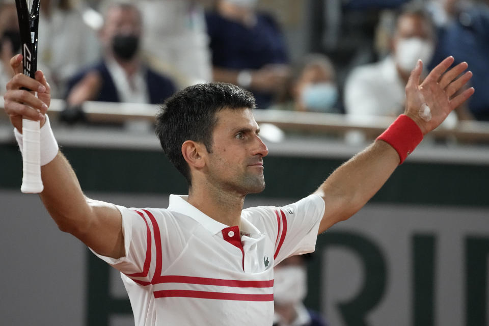 Serbia's Novak Djokovic reacts as he defeats Spain's Rafael Nadal during their semifinal match of the French Open tennis tournament at the Roland Garros stadium Friday, June 11, 2021 in Paris. Novak Djokovic won 3-6, 6-3, 7-6 (4), 6-2. (AP Photo/Michel Euler)