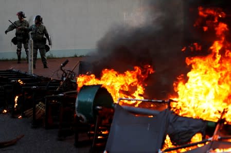 A barricade on fire set by anti-government protesters is pictured during a demonstration in Sha Tin