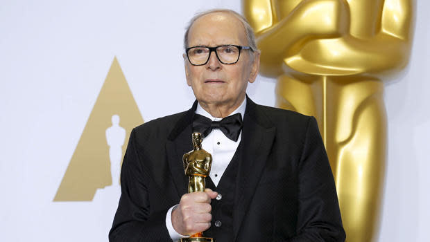 Composer Ennio Morricone poses with his Oscar for Best Original Score for 