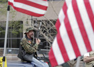 <p>People participate in a gun-rights rally at the state capitol, Saturday, April 14, 2018, in Indianapolis, Ind. The rally come less than three weeks after hundreds of thousands marched in Washington, New York and elsewhere to demand tougher gun laws after the February school shooting in Parkland, Florida, that killed 17. (Photo: Michael Conroy/AP) </p>