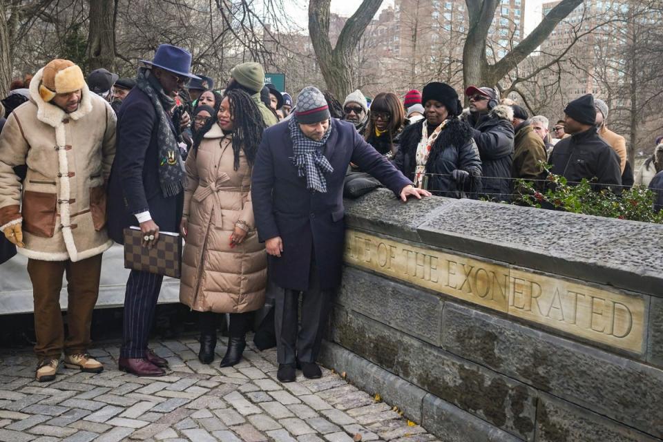 Kevin Richardson, far left, Yusef Salaam, second left, and Raymond Santana, far right in foreground, unveil the ‘The Gate of the Exonerated’ in Central Park in 2022 (Copyright 2022 The Associated Press. All rights reserved.)