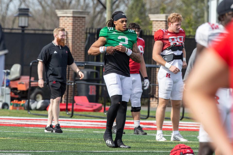 Rutgers quarterback Gavin Wimsatt warms up before Rutgers University football spring practice at Marco Battaglia Practice Complex in Piscataway, NJ Tuesday April 11, 2023.