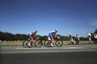 Belgium's Edward Theuns, left, and Switzerland's Stefan Kung rides in the breakeway during the 14th stage of the Tour de France cycling race over 194 kilometers (120,5 miles) with start in Clermont-Ferrand and finish in Lyon, France, Saturday, Sept. 12, 2020. (AP Photo/Thibault Camus)