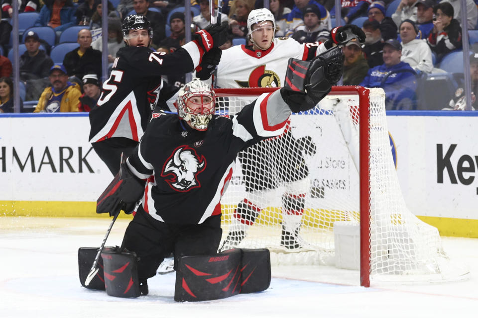 Buffalo Sabres goaltender Ukko-Pekka Luukkonen (1) reaches to make a glove save during the second period of the team's NHL hockey game against the Ottawa Senators on Thursday, Jan. 11, 2024, in Buffalo, N.Y. (AP Photo/Jeffrey T. Barnes)