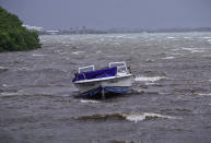 <p>A powerboat sits moored in shallow rough seas in the Florida Keys as winds and rain from the outer bands of Hurricane Irma arrive in Islamorada, Fla., on Sept. 9, 2017. (Photo: Gaston De Cardenas/AFP/Getty Images) </p>