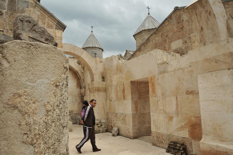 A visitor is seen at the ancient Haghartsin monastery, some 110 km northeast of Yerevan, on June 8, 2013
