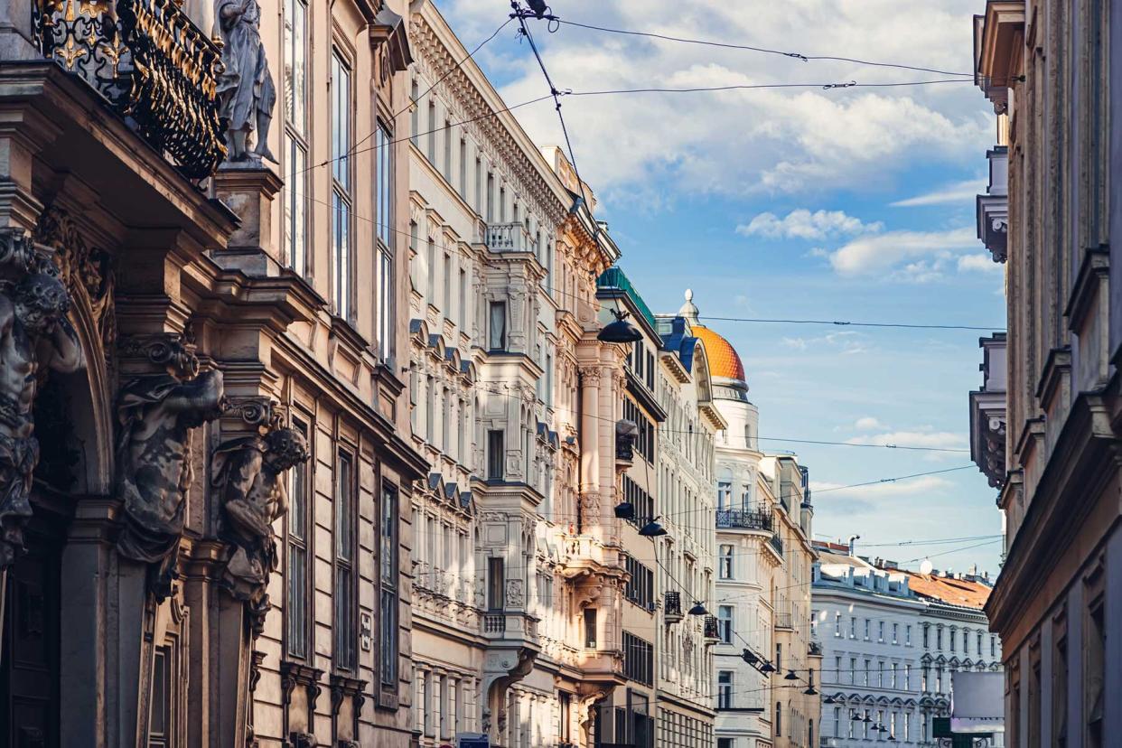 Residential buildings in Historic center of Vienna, classic European architecture against blue sky