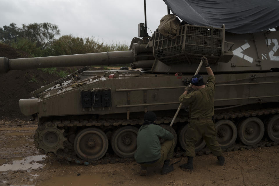 Israeli soldiers fix tracks near the border with Lebanon, in northern Israel, Thursday, Jan. 11, 2024. The prospect of a full-scale war between Israel and Lebanon’s Hezbollah militia terrifies people on both sides of the border, but some see it as an inevitable fallout from Israel’s ongoing war against Hamas in Gaza. (AP Photo/Leo Correa)