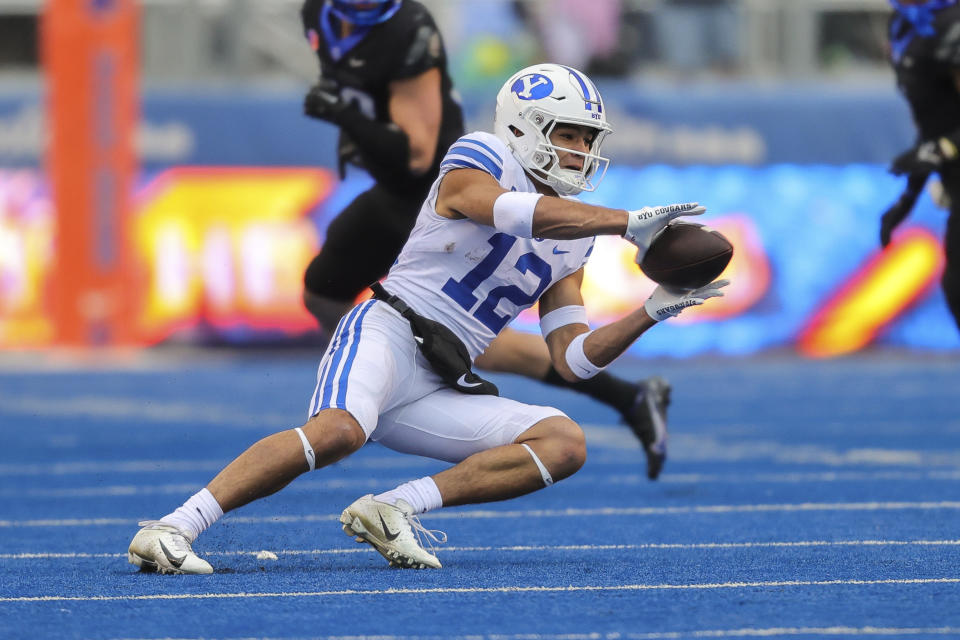 BYU wide receiver Puka Nacua (12) catches the ball against Boise State in the first half of an NCAA college football game, Saturday, Nov. 5, 2022, in Boise, Idaho. (AP Photo/Steve Conner)