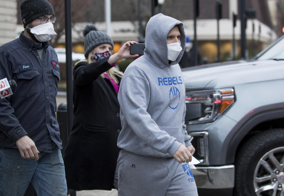 West Virginia Delegate Derrick Evans exits the Sidney L. Christie U.S. Courthouse and Federal Building after being arraigned on federal charges Friday, Jan. 8, 2021, in Huntington, W.Va. Evans, a West Virginia state lawmaker who posted videos online showing himself pushing his way inside the Capitol, was arrested Friday by the FBI at his home and charged with entering restricted federal property. Evans, who faced bipartisan calls for him to step down, submitted a letter of resignation Saturday, Jan. 9, 2021 to West Virginia Gov. Jim Justice and apologized for his actions. (Sholten Singer/The Herald-Dispatch via AP)