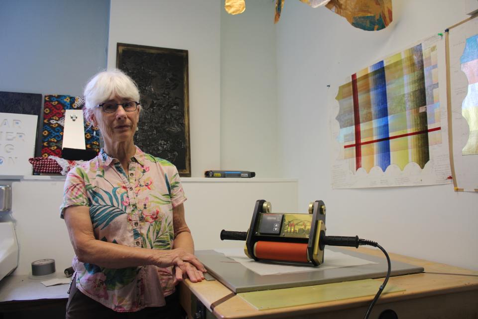 Deanne Wortman poses for a portrait inside her studio, Aug. 11, at the ArtiFactory, which is located in the basement of the Wesley Center at 120 N. Dubuque St.