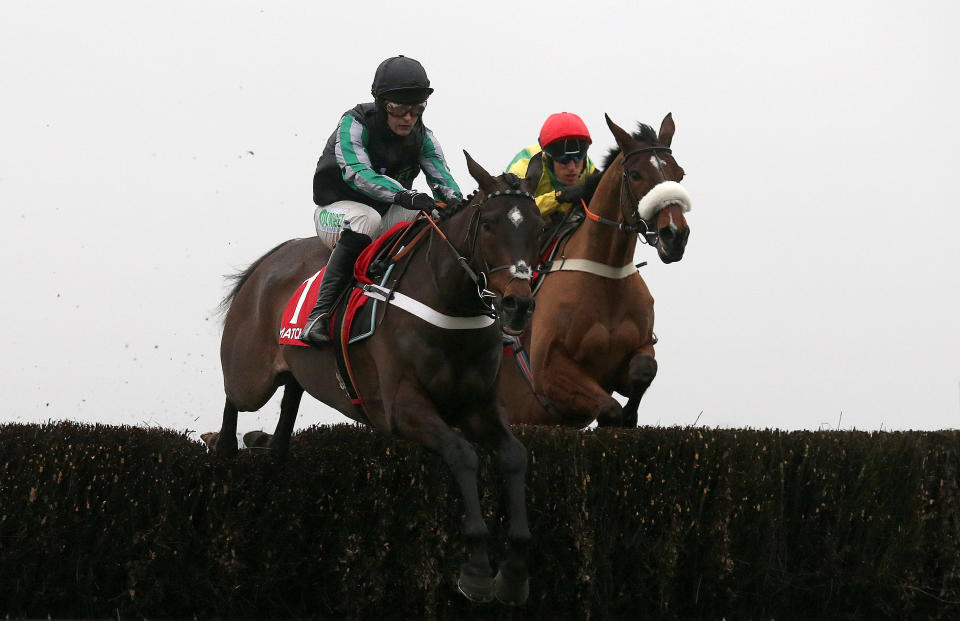 Altior and jockey Nico de Boinville jump clear of Fox Norton on their way to Clarence House Chase success at Ascot