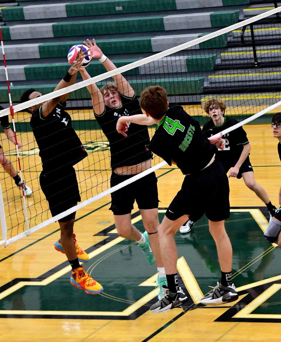 Gavin Gerhard (4) scores a kill for McNicholas at the OHSAA Division II boys regional volleyball championship, May 20, 2023.