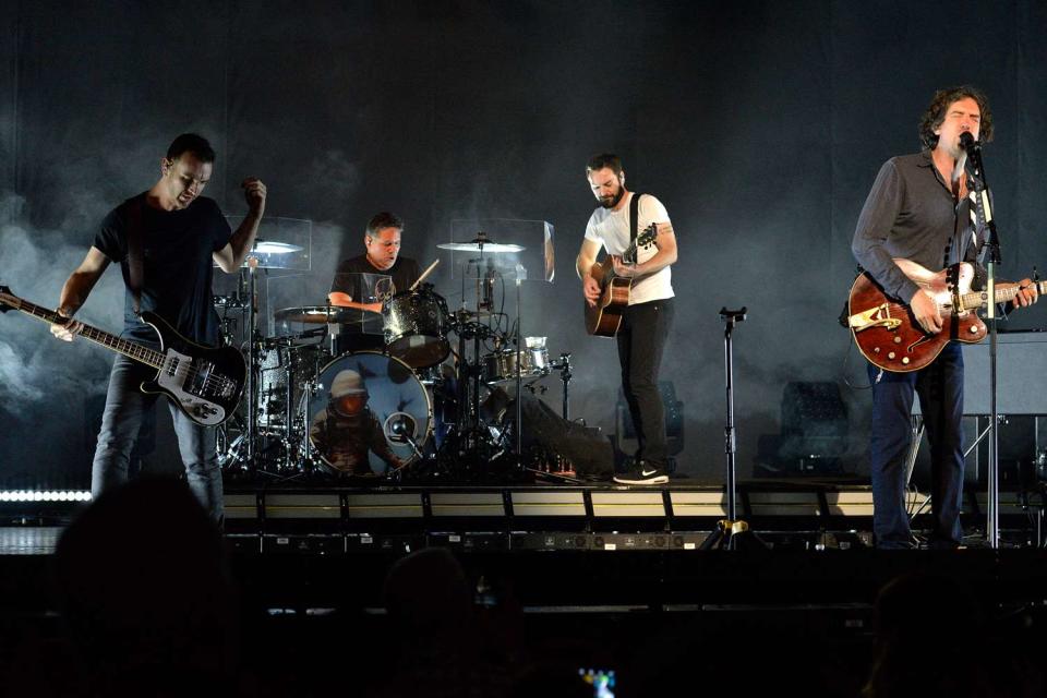 <p>Michael Tullberg/Getty </p> (L-R) Paul Wilson, Jonny Quinn, Johnny McDaid and Gary Lightbody of Snow Patrol perform in Los Angeles in 2019.