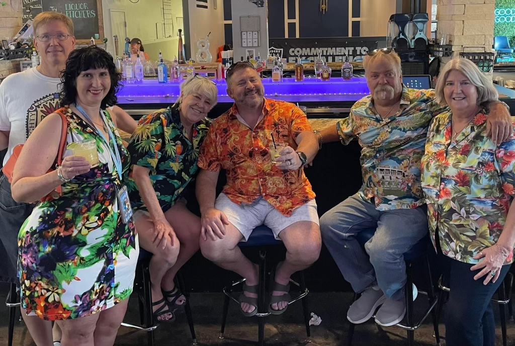 Calhoun (far right) and other Parrot Heads celebrating Jimmy Buffett at 