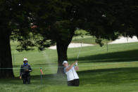 Sweden's Caroline Hedwall, center, hits toward the third green at the International Crown match play golf tournament in San Francisco, Thursday, May 4, 2023. (AP Photo/Jeff Chiu)