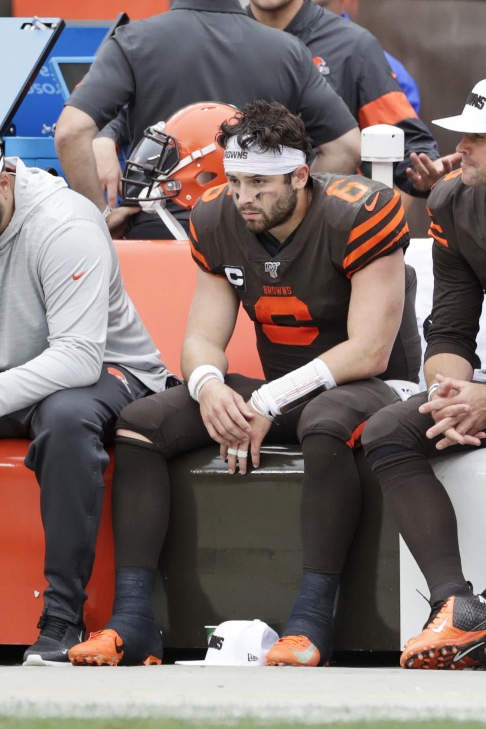 Cleveland Browns quarterback Baker Mayfield sits on the sidelines during the second half in an NFL football game against the Tennessee Titans, Sunday, Sept. 8, 2019, in Cleveland. The Titans won 43-13. (AP Photo/Ron Schwane)
