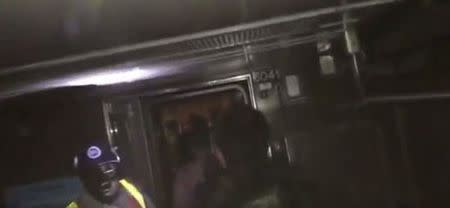 Passengers evacuate from a train in the dark following a subway train incident in the Manhattan borough of New York, United States June 27, 2017, in this still image taken from a video obtained from social media. Twitter/@cutdekProd/via REUTERS