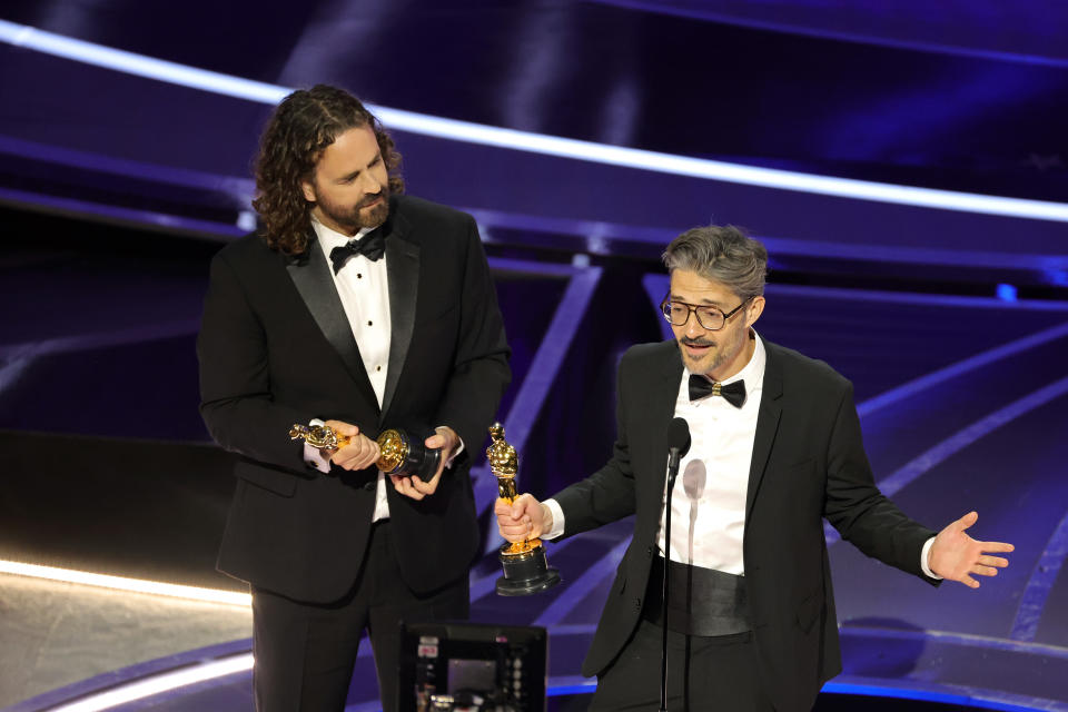 HOLLYWOOD, CALIFORNIA - MARCH 27: (L-R) Leo Sanchez Barbosa and Alberto Mielgo accept the Animated Short Film Award for 'The Windshield Wiper' onstage during the 94th Annual Academy Awards at Dolby Theatre on March 27, 2022 in Hollywood, California. (Photo by Neilson Barnard/Getty Images)