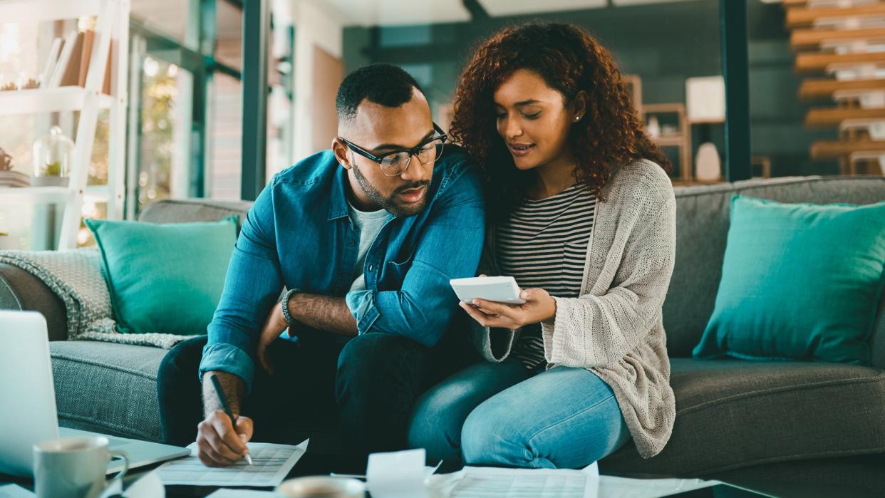 young couple working on their financial taxes