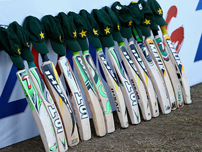 Pakistan honour Hughes with their bats and caps during their Test against New Zealand