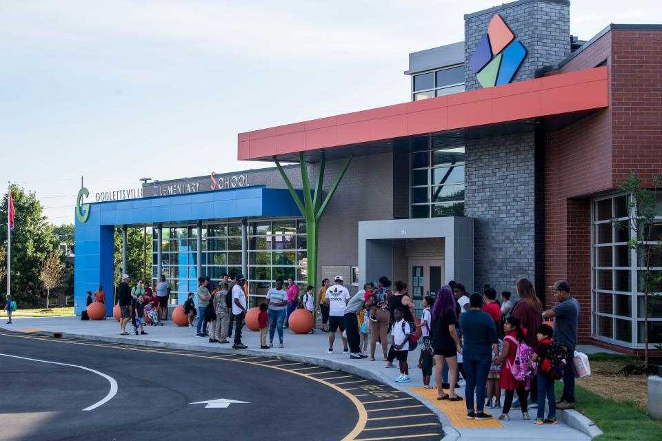 Families and students crowd around the front of Goodlettsville Elementary School on the first day of school in Goodlettsville, Tenn., Tuesday, Aug. 8, 2023.