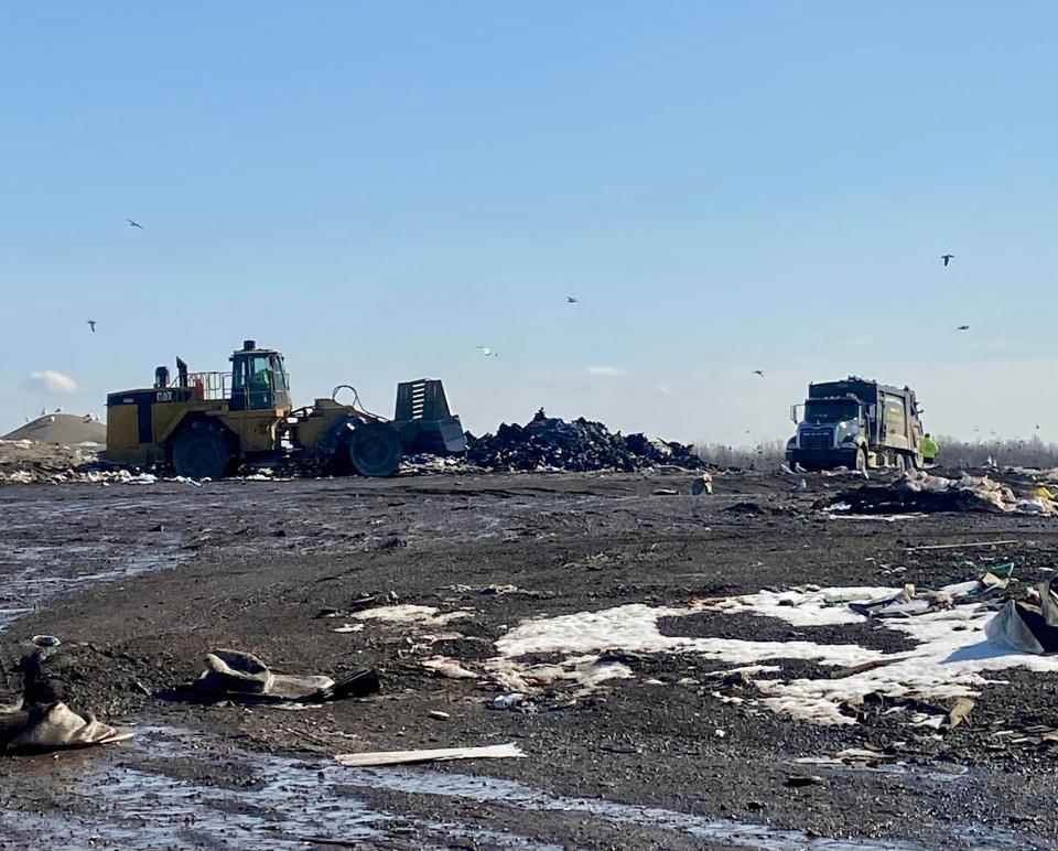 A garbage truck unloads at the Smiths Creek Landfill in Kimball Township Wednesday, March 1, 2023.