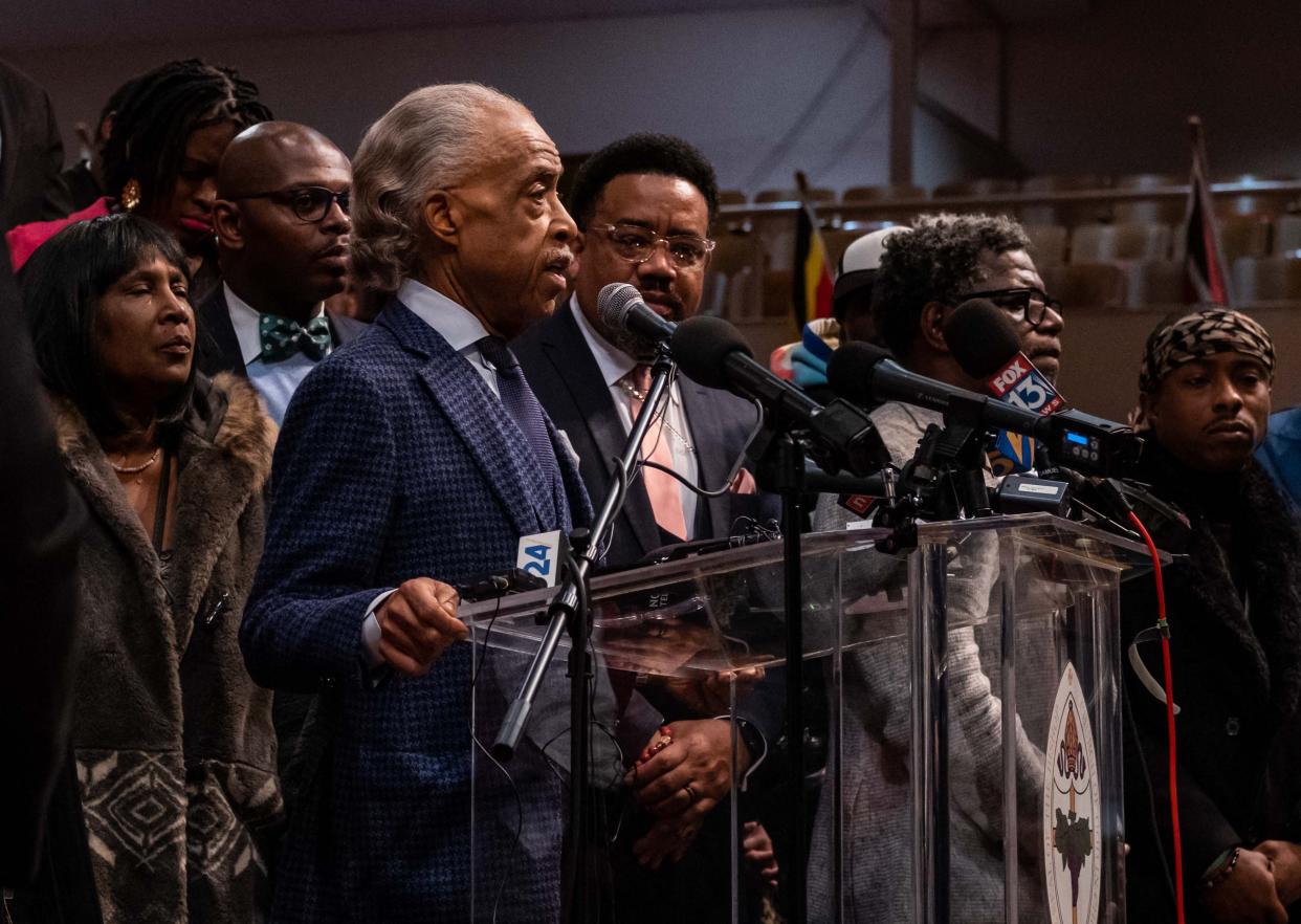 The mother of Tyre Nichols, RowVaughn Wells listens as Reverend Al Sharpton speaks during a news conference at Mason Temple: Church of God in Christ World Headquarters in Memphis, Tennessee (AFP via Getty Images)