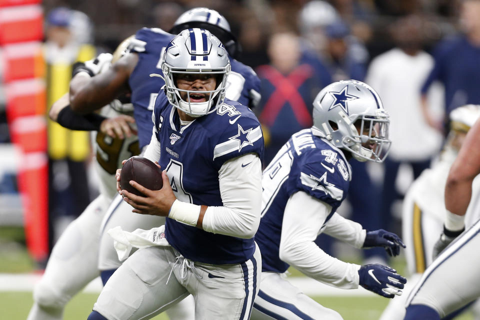 Dallas Cowboys quarterback Dak Prescott (4) scrambles in the first half of an NFL football game against the New Orleans Saints in New Orleans, Sunday, Sept. 29, 2019. (AP Photo/Gerald Herbert)