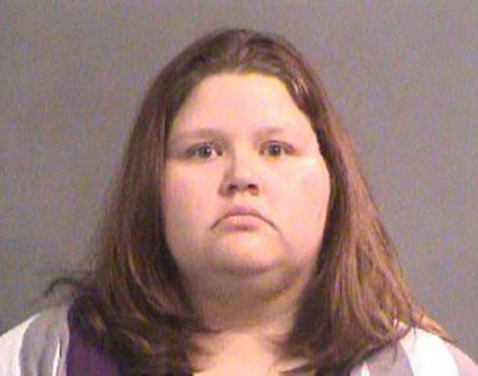 FILE--In this undated file photo provided by the Sedgwick County Jail shows Sarah Hopkins. The families of victims in a 2016 mass shooting in central Kansas have won a $2 million settlement from the now-defunct pawn shop that sold the guns to the shooter, Cedric Ford's girlfriend, Hopkins. The settlement of three lawsuits in Harvey County District Court was announced Wednesday by Brady, a national center against gun violence. Victims' families argued that the pawn shop should have known that shooter's girlfriend was a straw buyer. (Courtesy Sedgwick County Jail via The Wichita Eagle via AP, File)