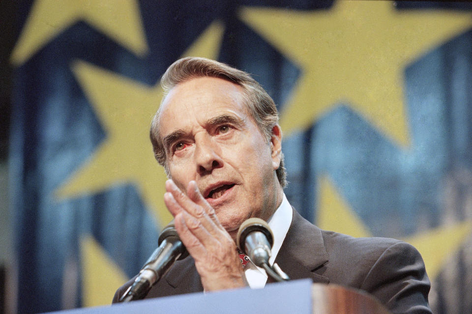 FILE - Sen. Bob Dole, R-Kan., makes a speech to supporters as he announced his bid for the Republican nomination for president in Topeka, Kan., April 10, 1995. Bob Dole, who overcame disabling war wounds to become a sharp-tongued Senate leader from Kansas, a Republican presidential candidate and then a symbol and celebrant of his dwindling generation of World War II veterans, has died. He was 98. His wife, Elizabeth Dole, posted the announcement Sunday, Dec. 5, 2021, on Twitter. (AP Photo/Doug Mills, File)