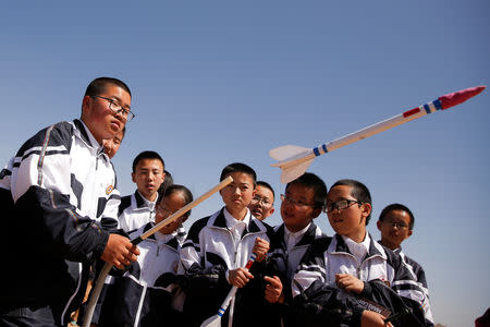 A student launches a toy rocket at the C-Space Project Mars simulation base in the Gobi Desert outside Jinchang, Gansu Province, China, April 17, 2019. REUTERS/Thomas Peter