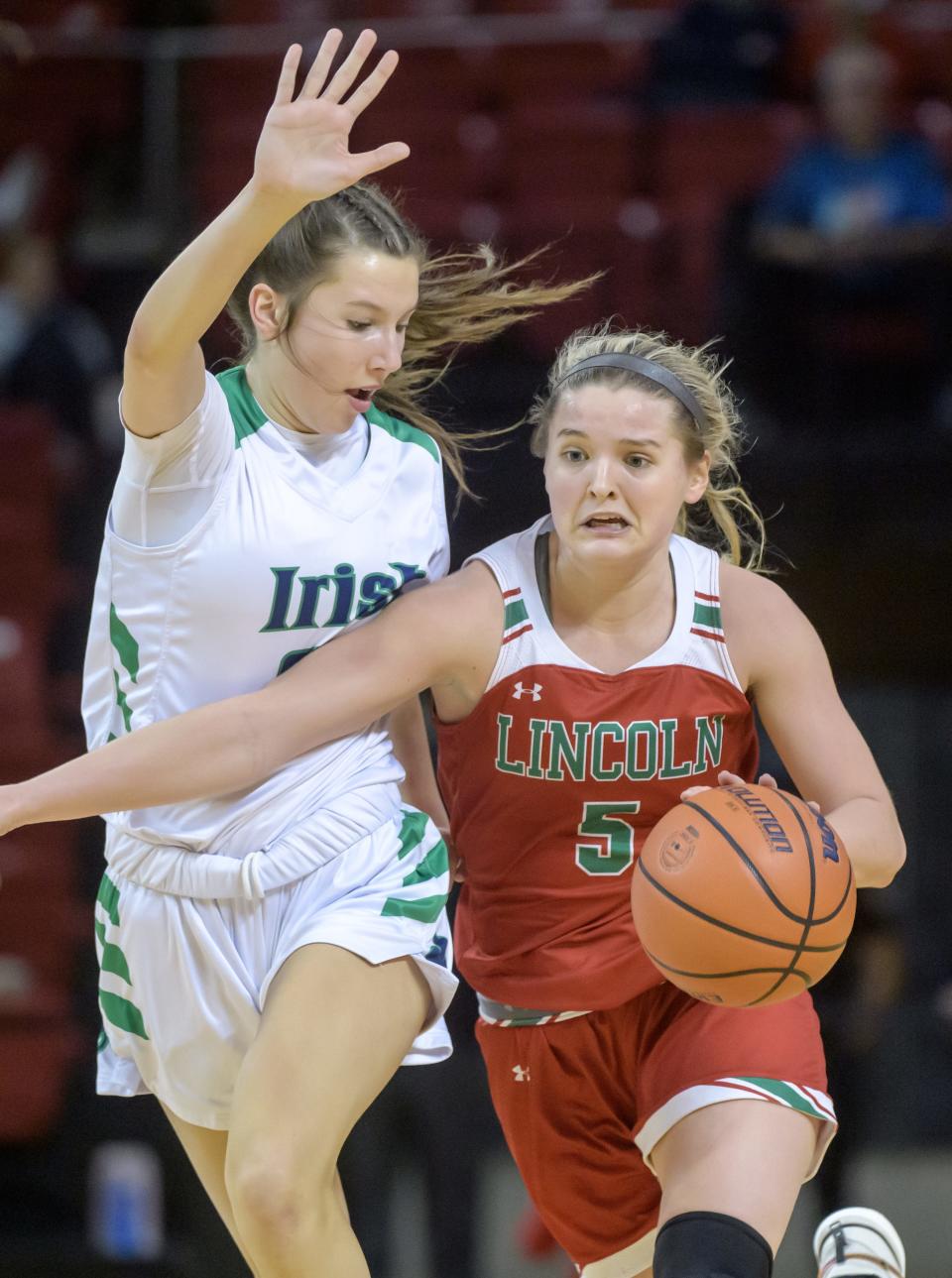 Lincoln's Kloe Froebe, right, moves the ball against Peoria Notre Dame's Emy Wardle in the second half of their nonconference basketball game Saturday, Jan. 20, 2024 at Renaissance Coliseum in Peoria. The Irish fell to the Railsplitters 63-52.