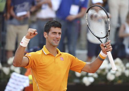 Novak Djokovic of Serbia celebrates winning against Roger Federer of Switzerland after their final match at the Rome Open tennis tournament in Rome, Italy, May 17, 2015. REUTERS/Stefano Rellandini