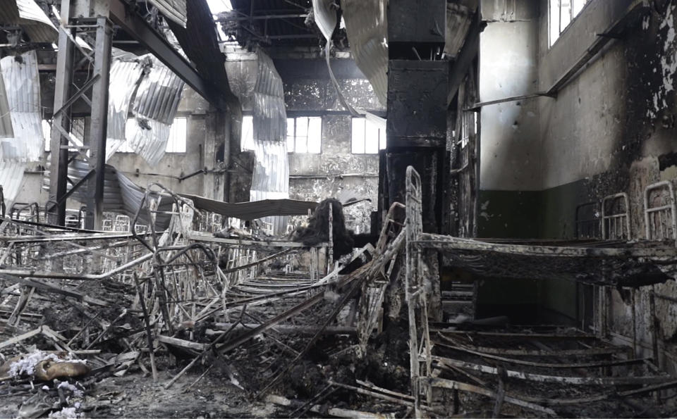 EDS NOTE: GRAPHIC CONTENT - In this photo taken from video a view of destroyed barrack at a prison in Olenivka, in an area controlled by Russian-backed separatist forces, eastern Ukraine, on July 29, 2022. Ukrainian officials say they are struggling to establish the truth surrounding the explosion in a prison that killed dozens of Ukrainian prisoners of war captured by the Russians following the fall of Mariupol. (AP Photo)